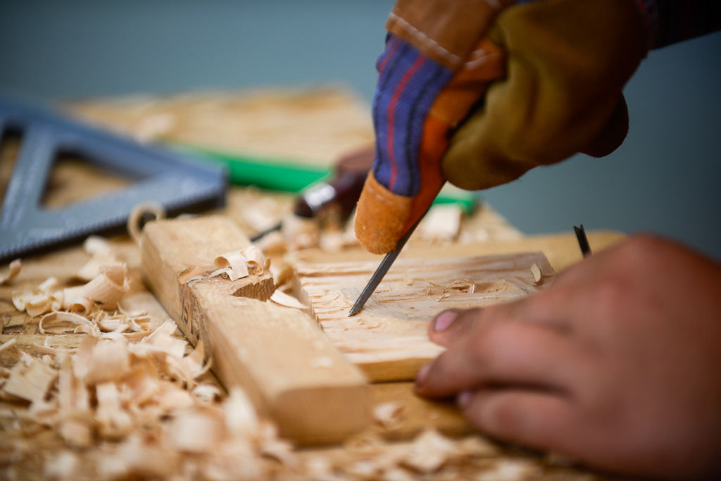 Cody Schultz of Troop 707 uses a hand tool